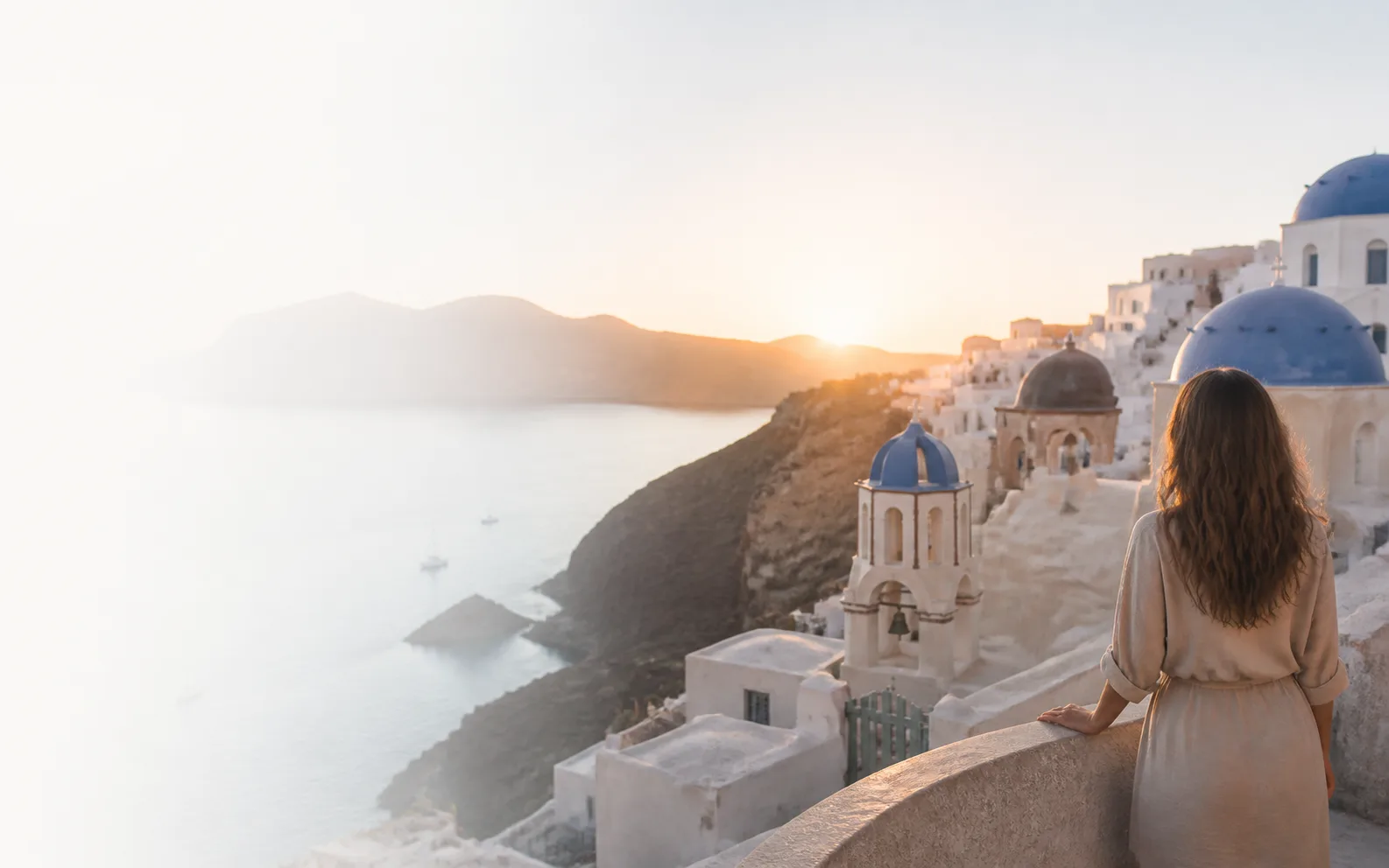 Traveler overlooking Santorini, Greece